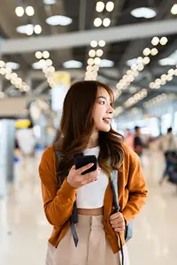 A woman exploring a modern airport