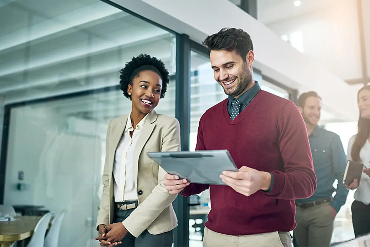 HR professionals working on a HR portal on a tablet