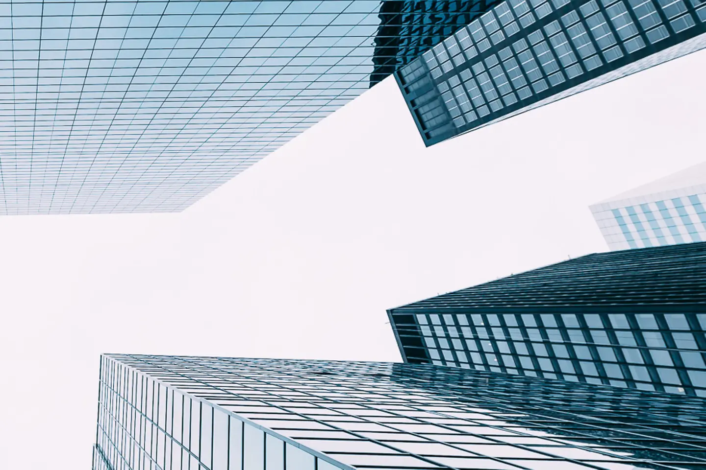 Several modern skyscrapers seen from a frog's eye view