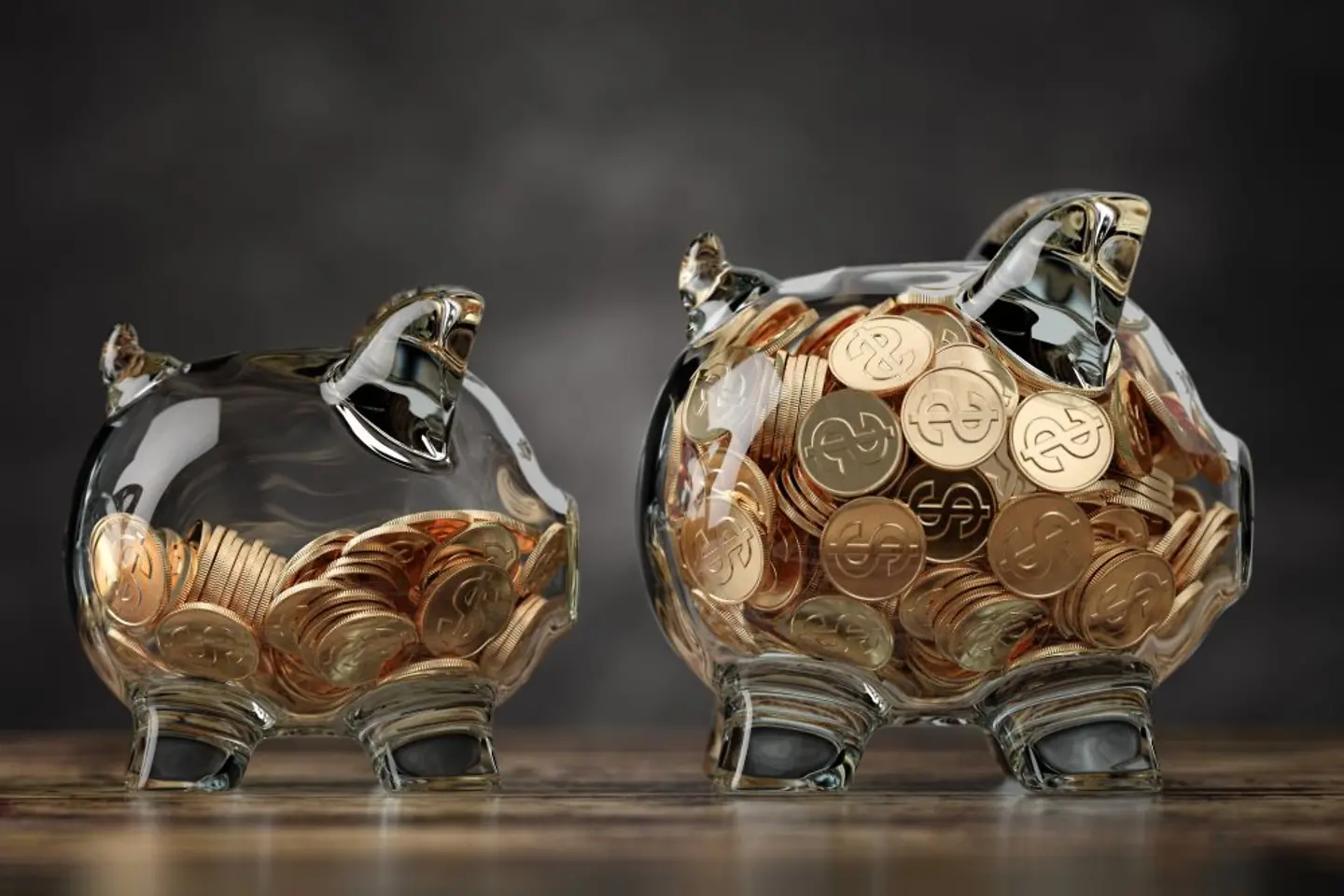 Two glass piggy banks with golden coins symbolizing financial growth, cost efficiency and quality increase by cloud services