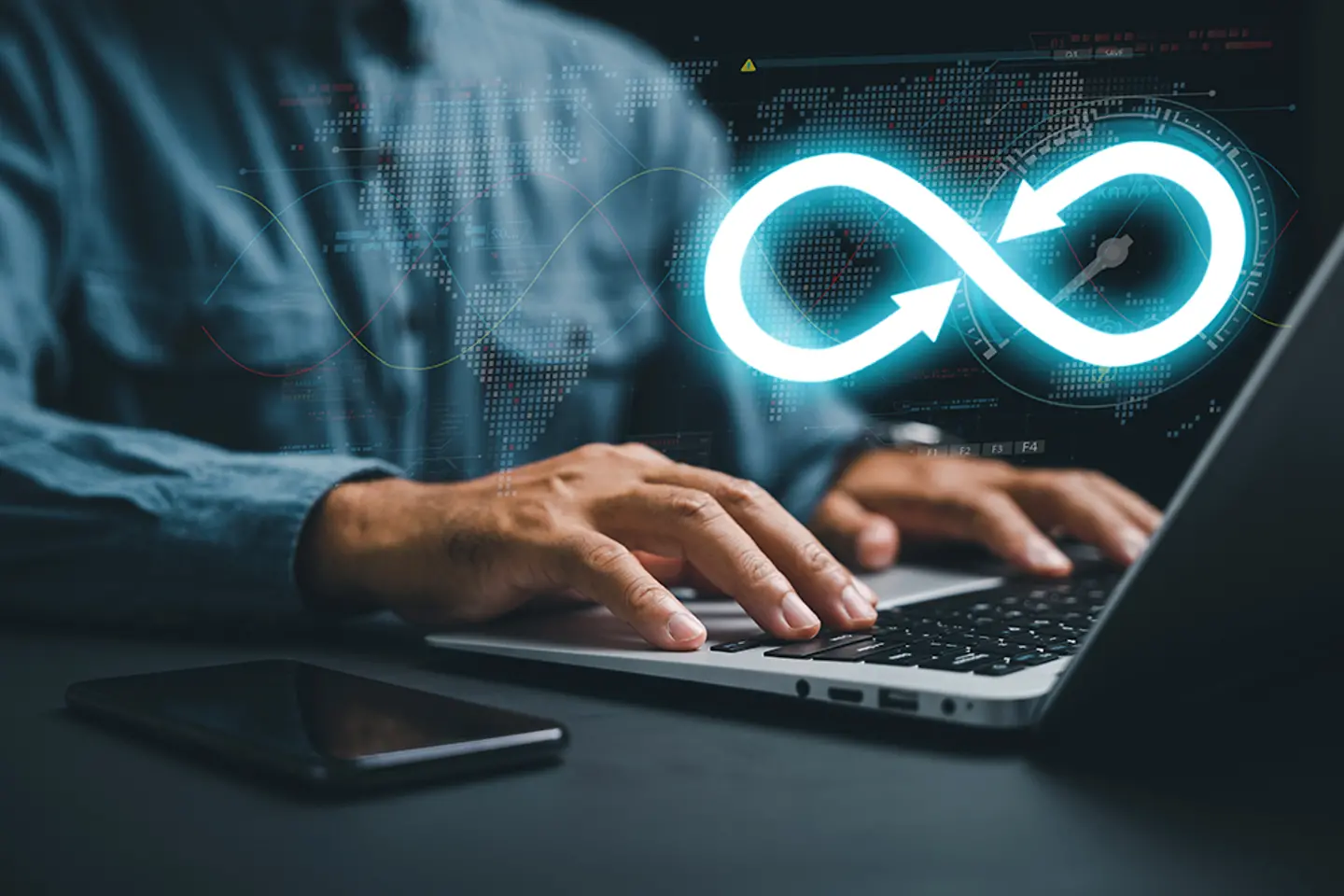 A DevOps engineer working on a laptop