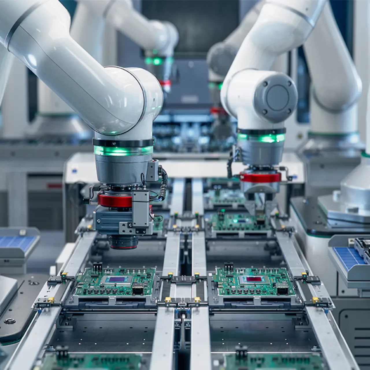 Robotic arms assembling circuits in a modern electronic factory