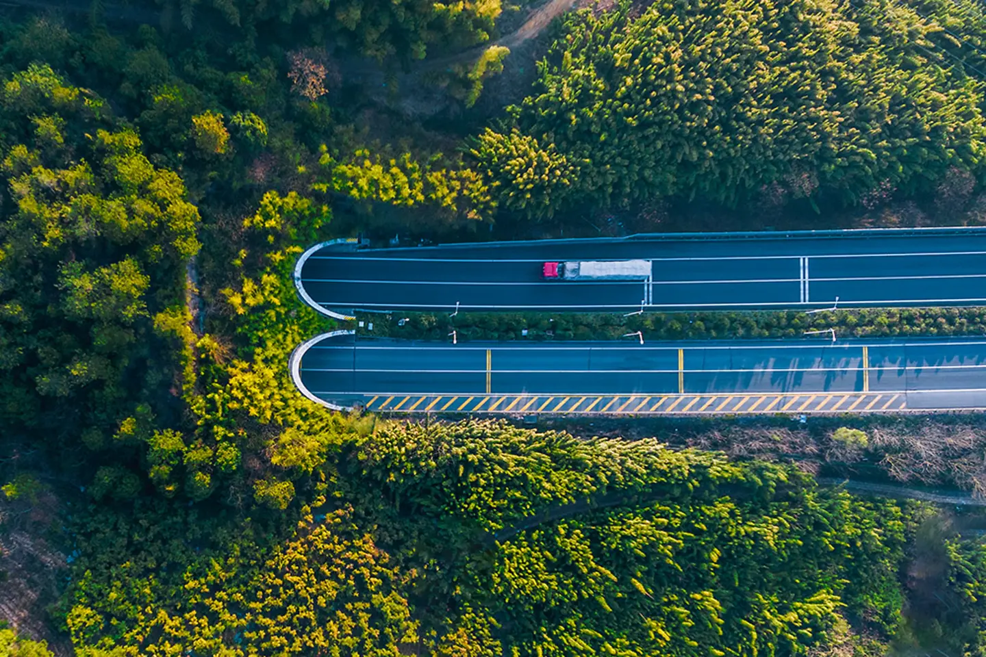 High angle view of a truck moving towards highway tunnel