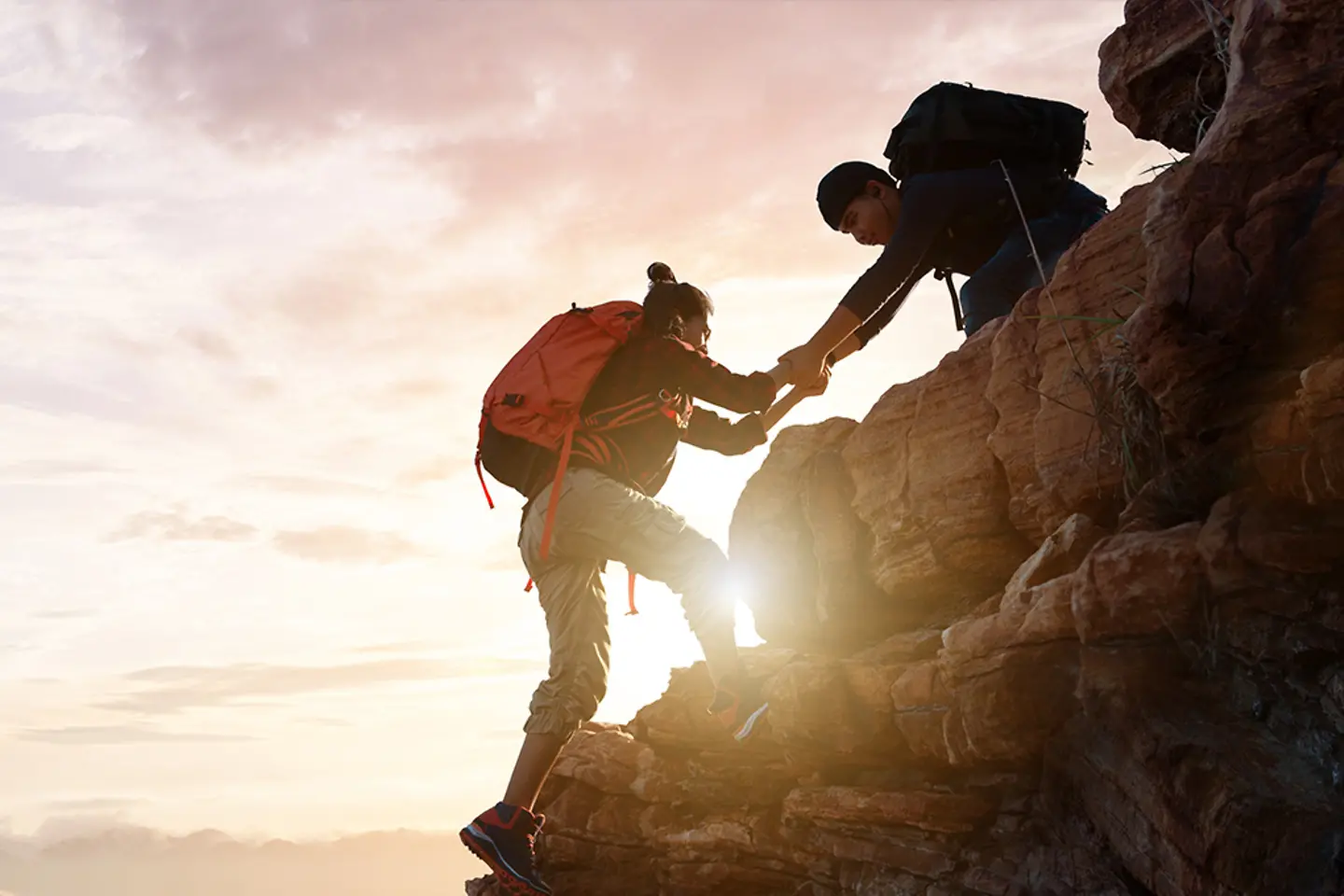 Asia couple hiking help each other on mountains 