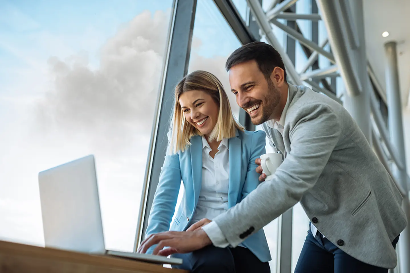 Two happy professionals discussing, we know no limits