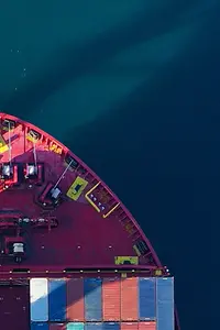 AI-generated image - Front of a loaded container ship in deep blue water