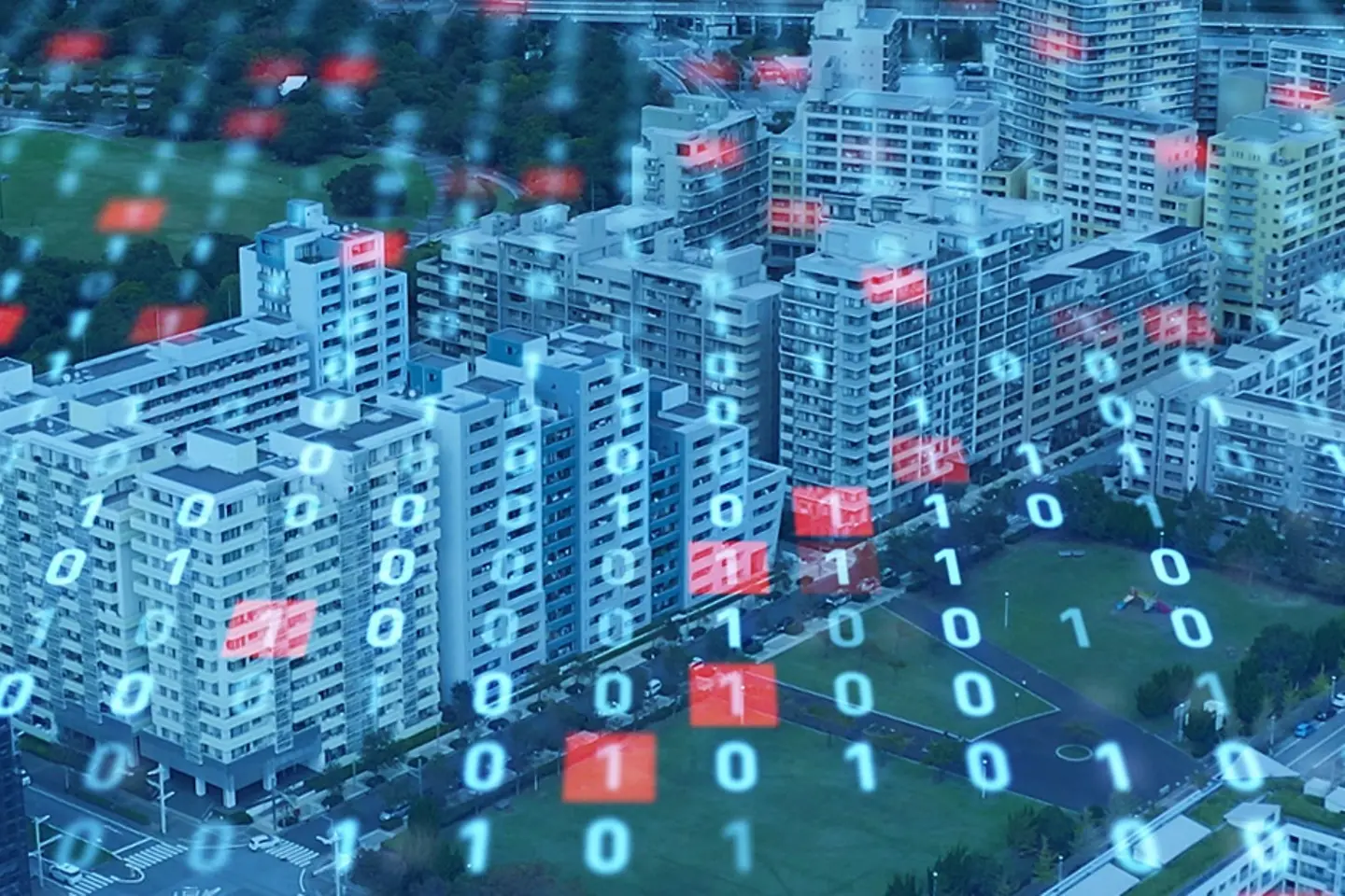 Vista aérea de un paisaje con edificios altos y con códigos binarios volando