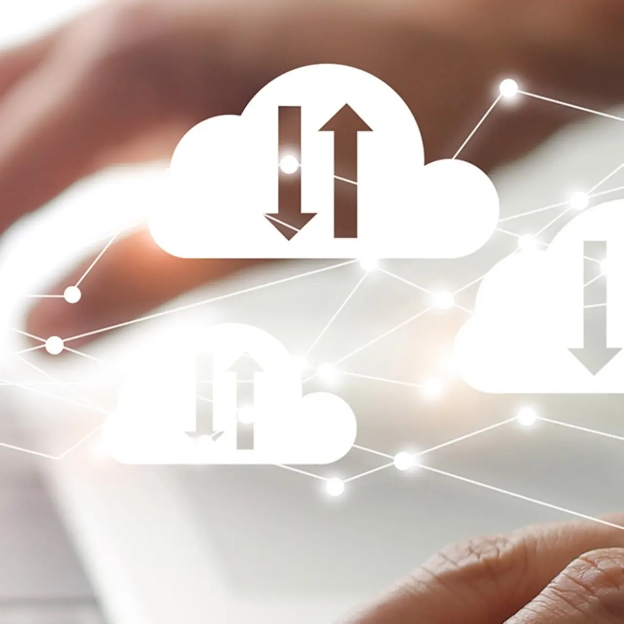 Laptop behind a network of cloud icons