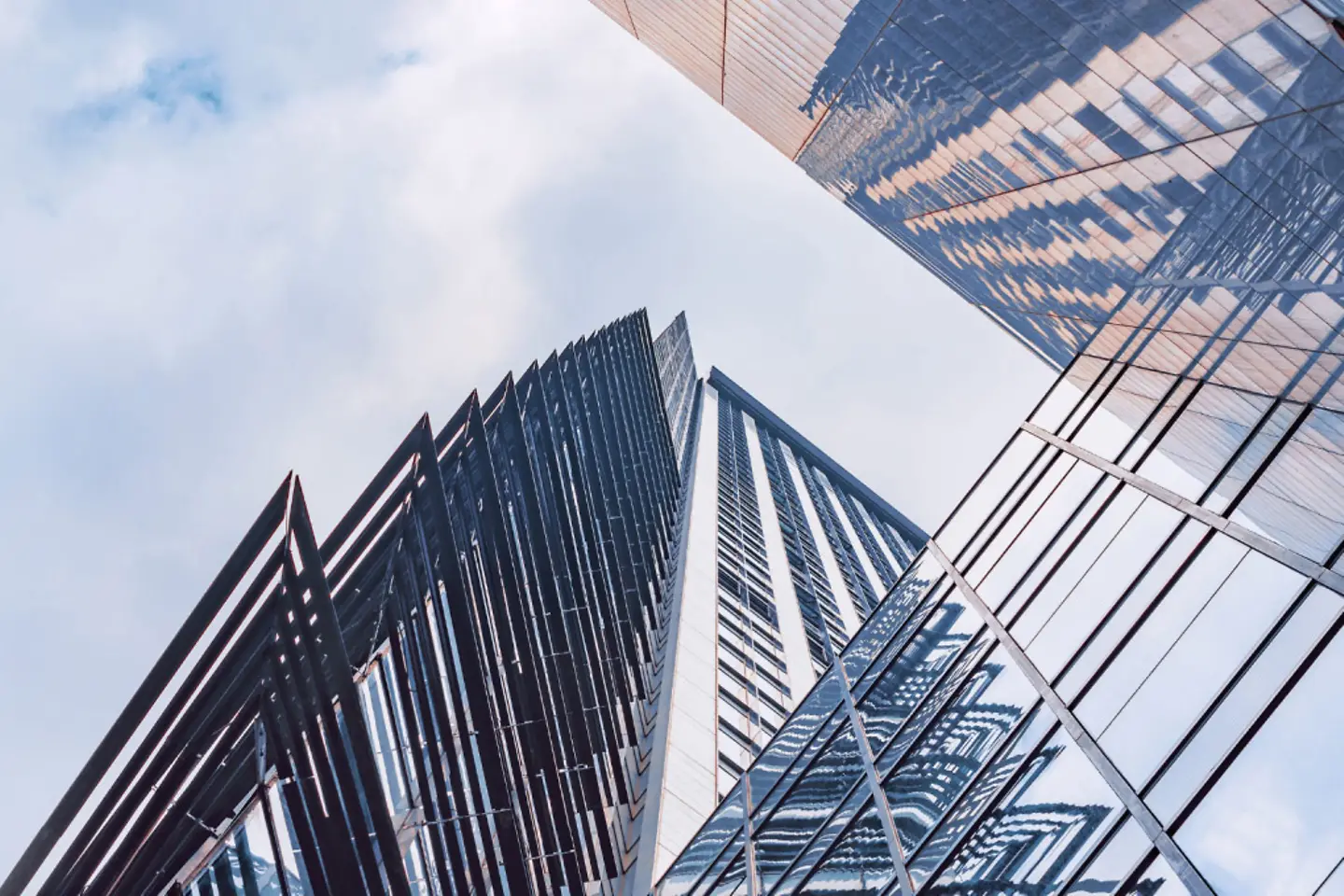 Modern glass skyscrapers against sky Modern glass skyscrapers against sky