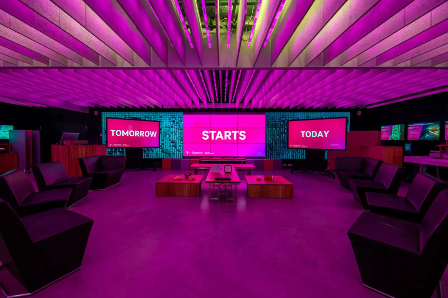  Innovation Center Munich with screens, tables and chairs