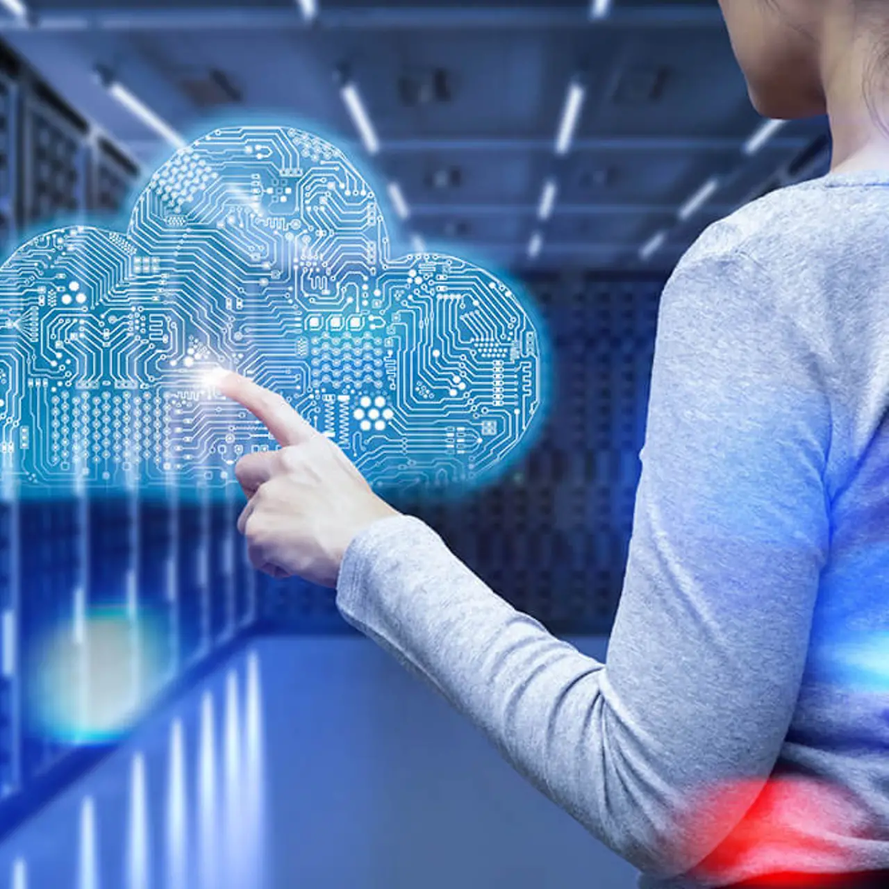 woman points at holographic cloud in server room