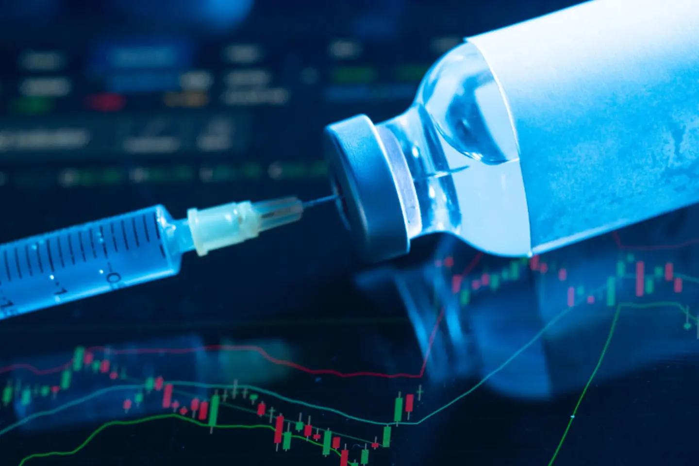 A syringe inserted in a flask of vaccine against a dark background and diagrams