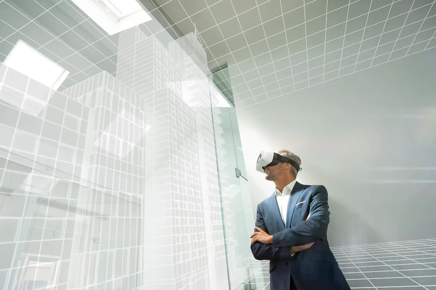 Employee with VR glasses in an abstract office building