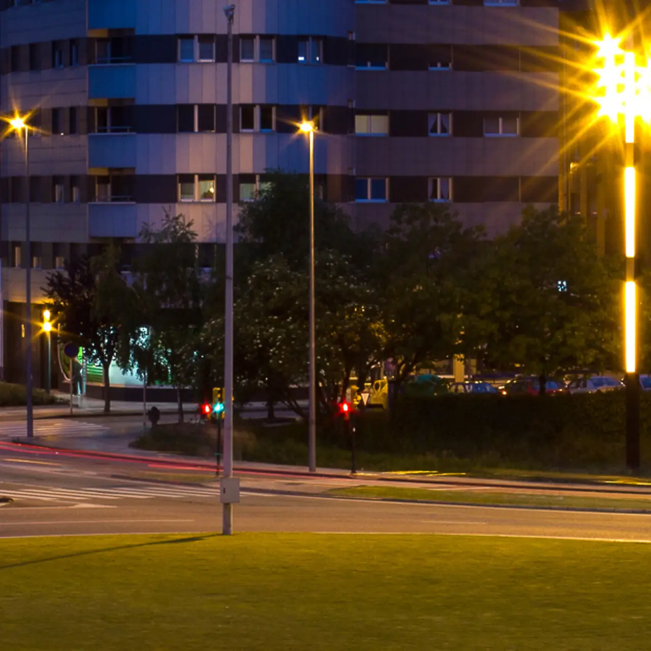 Huge traffic circle in a big city at night.